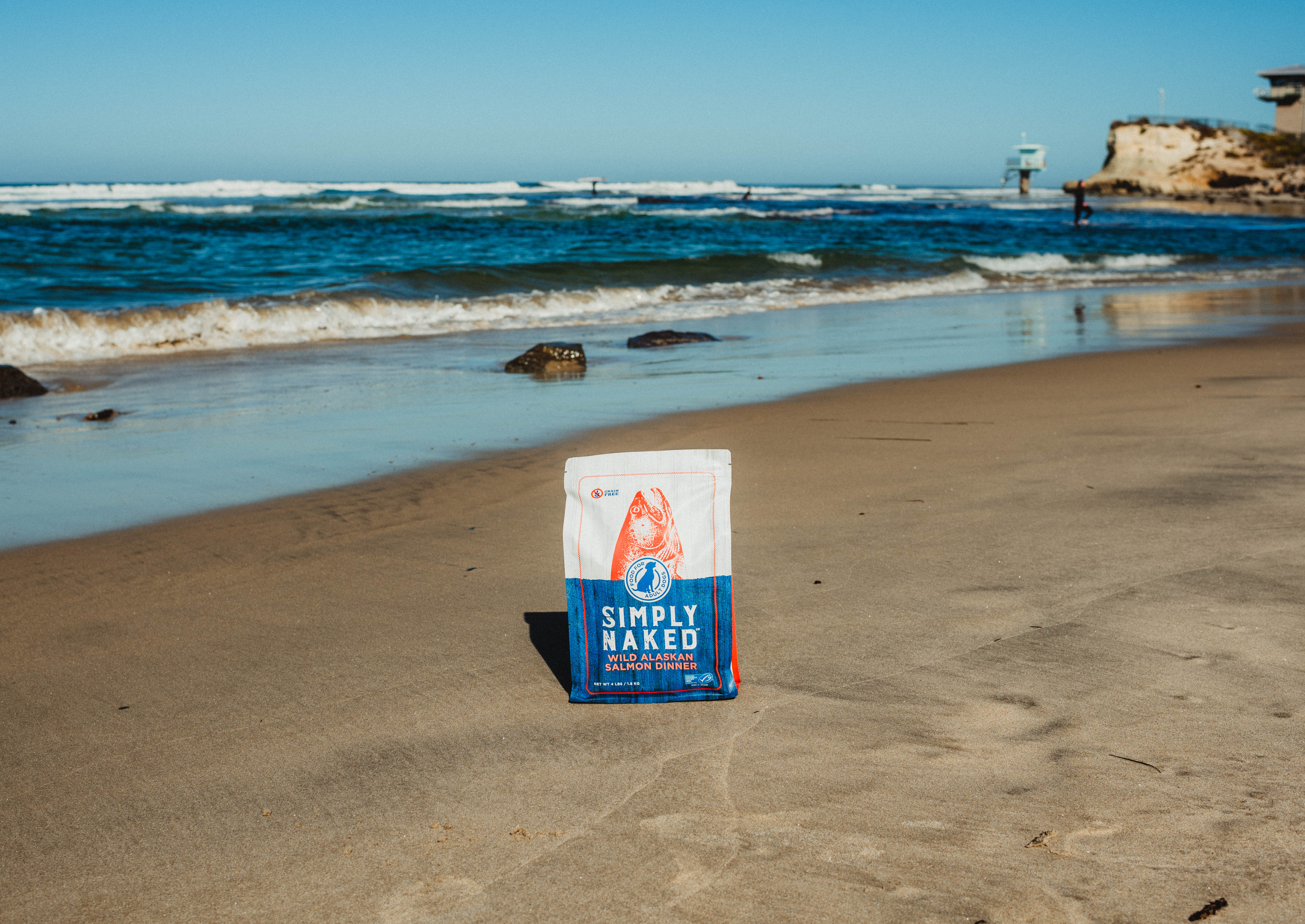 Bag of Simply Naked Pet Food near the ocean